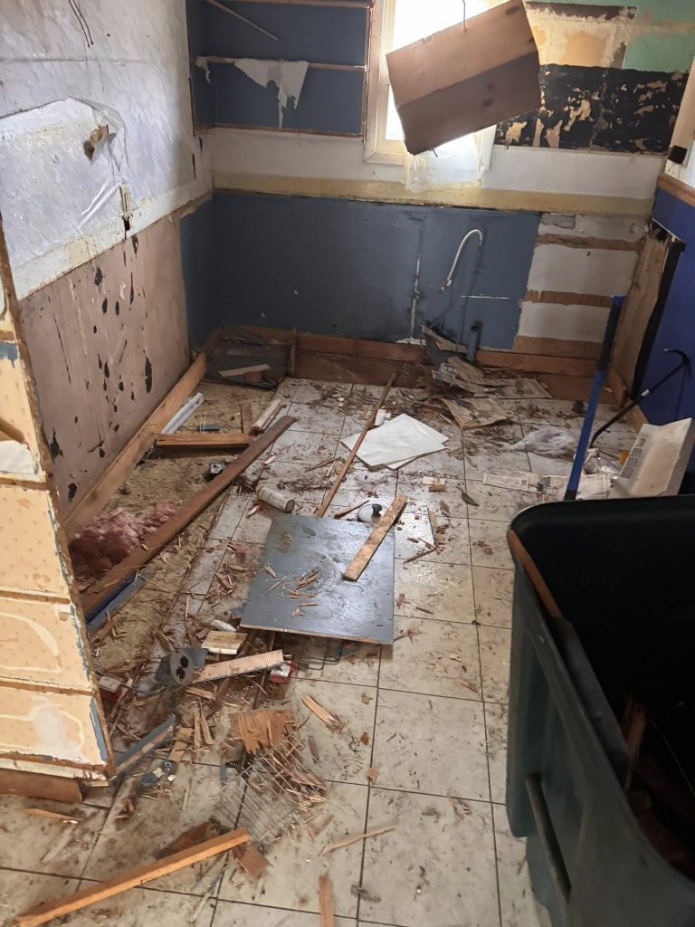 Wood and construction debris before interior cleanup