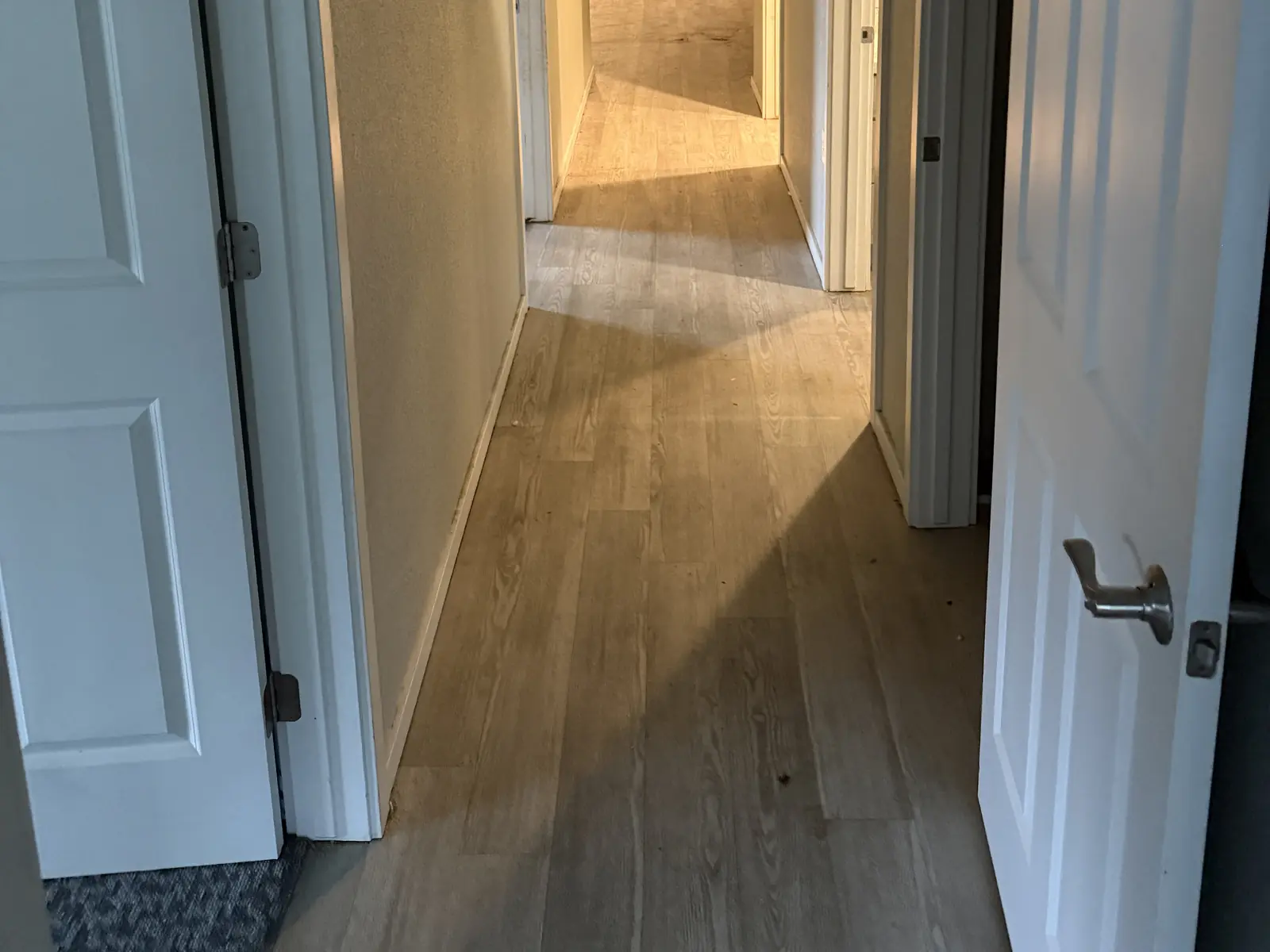 The same hallway cleared of household debris after the cleanout